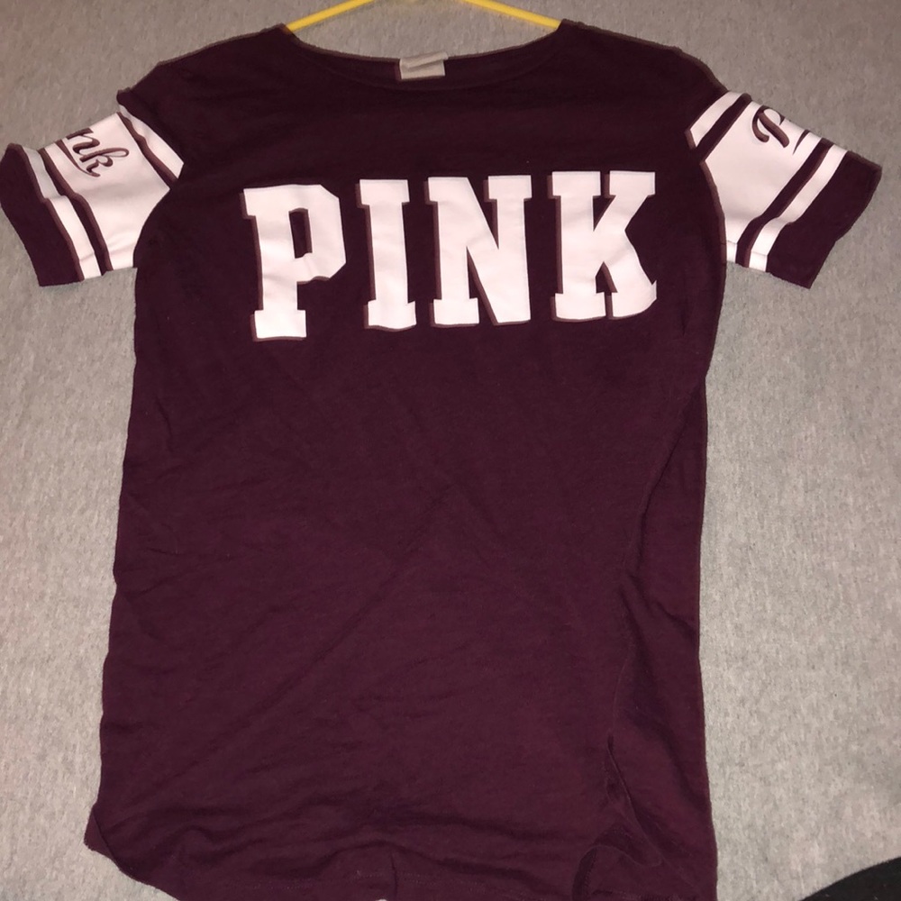 A pink Victoria’s Secret maroon T-shirt size (xs)